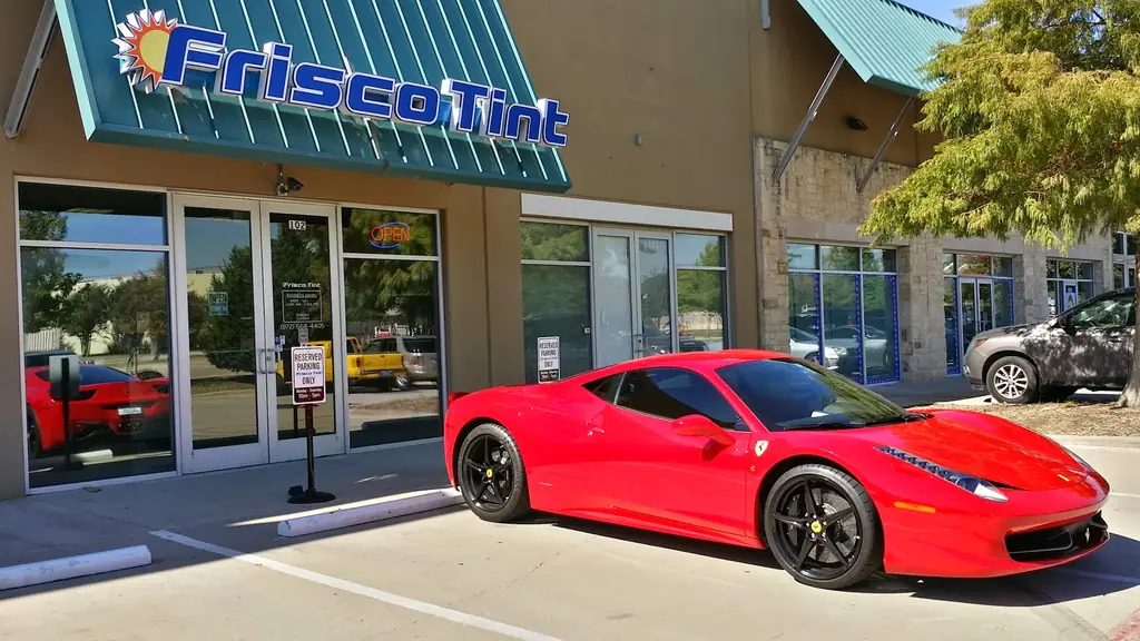 The Frisco Tint storefront on Ohio Drive with a car parked outside